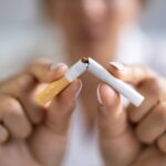 Young slim woman enjoys weight loss result